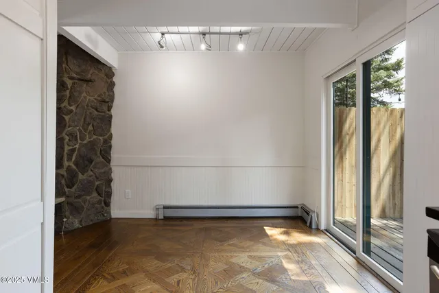a kitchen with granite countertop white cabinets white stainless steel appliances and a sink