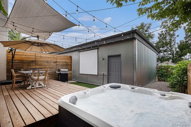 a front view of a house with a yard and an trees