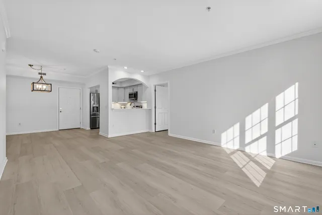 a view of a kitchen with a sink and a window