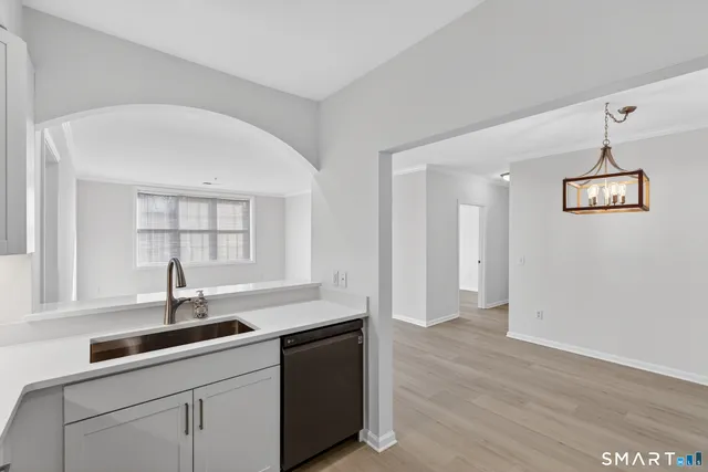 a kitchen with a sink and a window