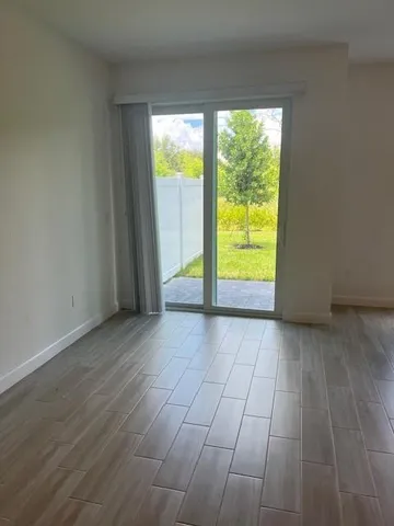 a view of an empty room with a window