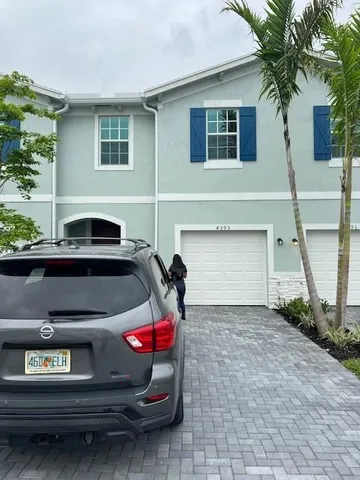 a front view of a house with a garage