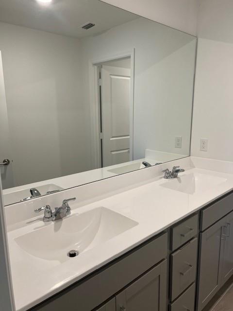4393 Hammock Grove Drive Lake Worth, FL 33467 - Photo 29 of 32 a bathroom with a sink and a mirror