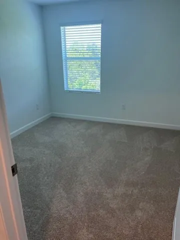 a white toilet sitting next to a bath tub