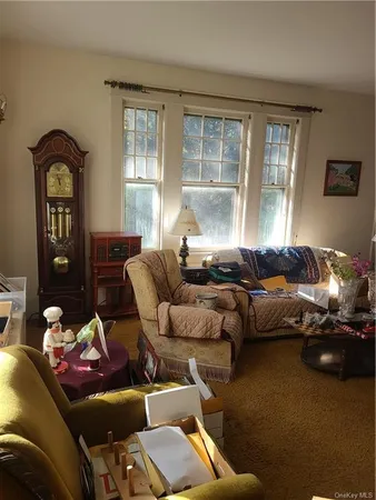 a bedroom with furniture and a window