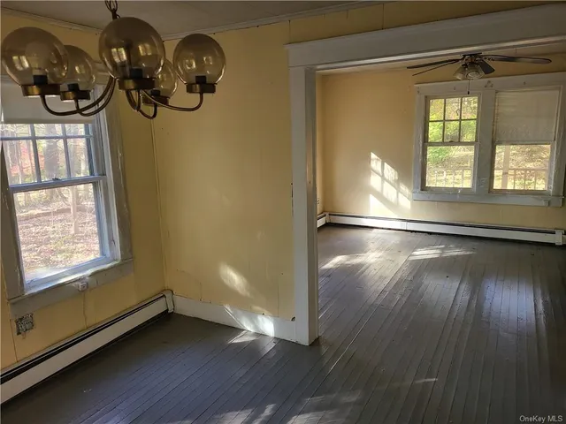 a view of an empty room with a windows