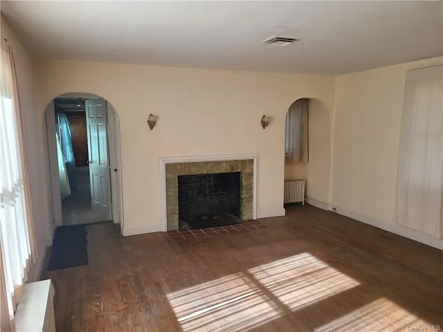 a bathroom with a granite countertop sink mirror and a bathtub