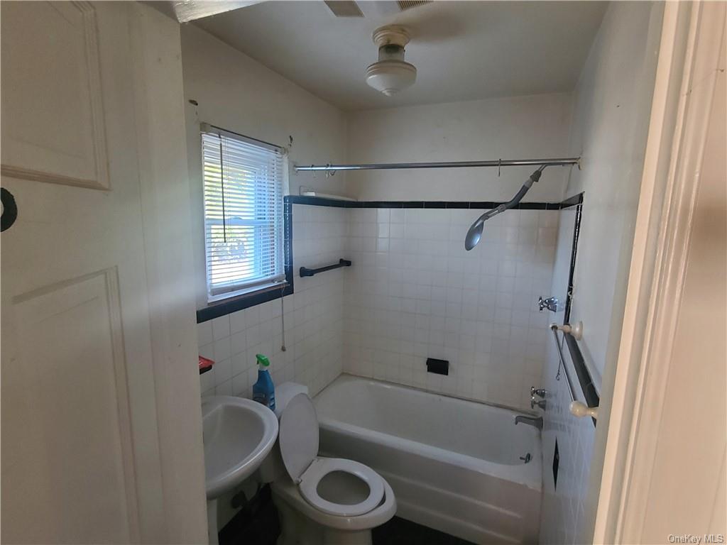 62 Old Glenham Road Fishkill, NY 12524 - Photo 24 of 33 a bathroom with a tub a sink and a window