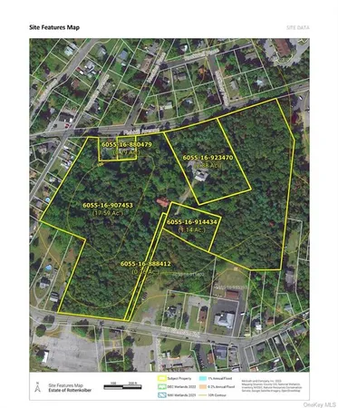 a picture of a room with a white bed and a chair