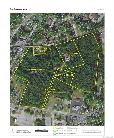 a picture of a room with a white bed and a chair