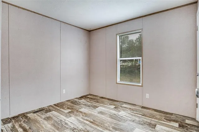 a view of a bedroom with a window