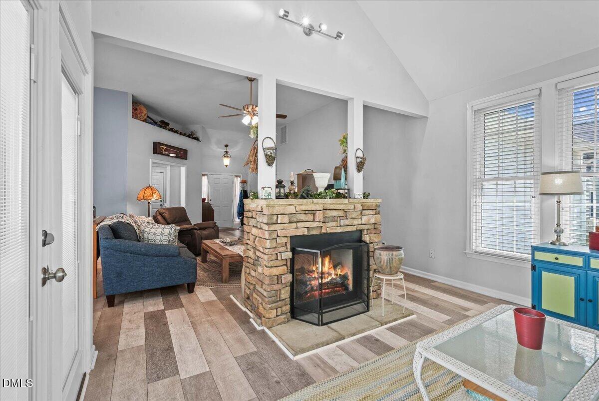 3331 Swinford Court Raleigh, NC 27604 - Photo 10 of 27 a living room with furniture and a fireplace