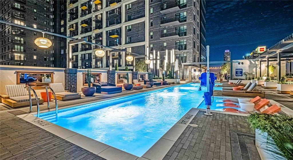 1301 Spring Street Northwest, Unit A3 Atlanta, GA 30309 - Photo 1 of 39 a view of a swimming pool with sitting area
