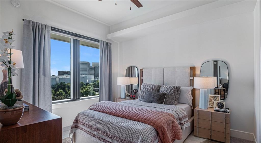 1301 Spring Street Northwest, Unit A3 Atlanta, GA 30309 - Photo 22 of 39 a bed room with a bed and a large window