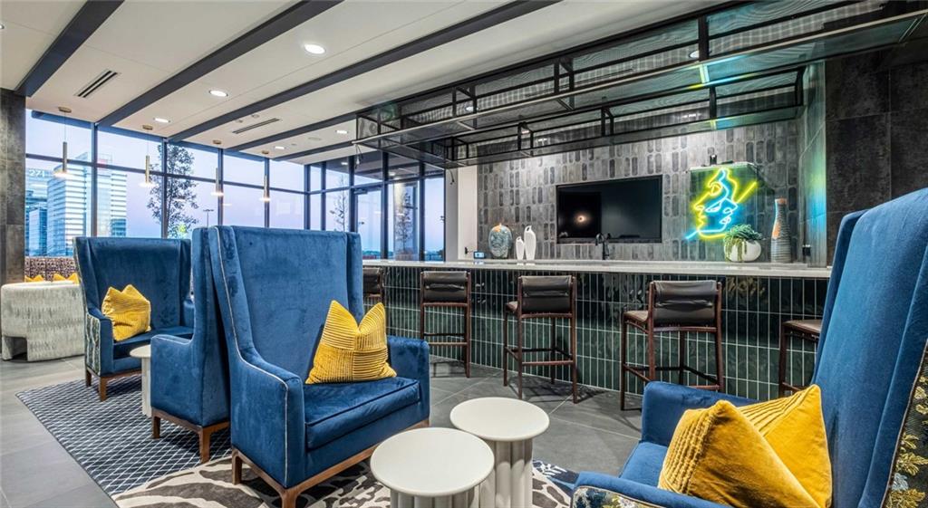 1301 Spring Street Northwest, Unit A3 Atlanta, GA 30309 - Photo 5 of 39 a living room with furniture and a fireplace