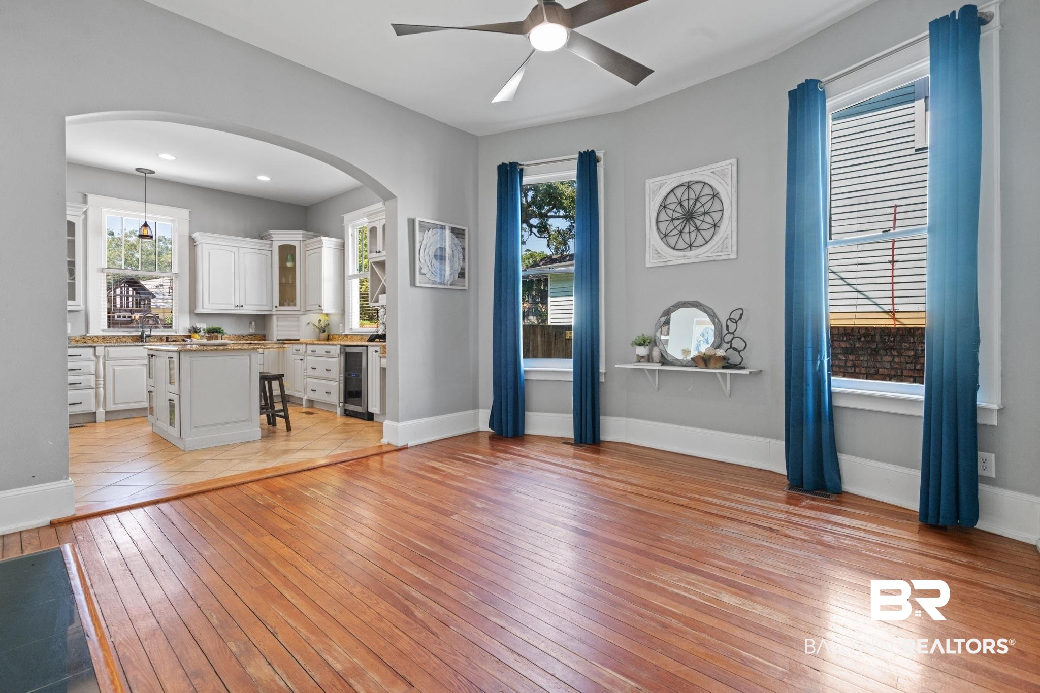 10 South Monterey Street Mobile, AL 36604 - Photo 11 of 45 Foyer entrance with light wood-style flooring, arched walkways, a ceiling fan, and beverage cooler