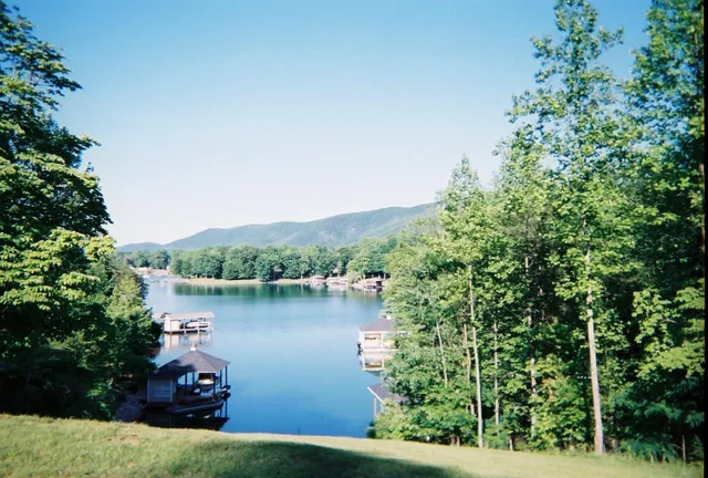 an aerial view of a house with lake view
