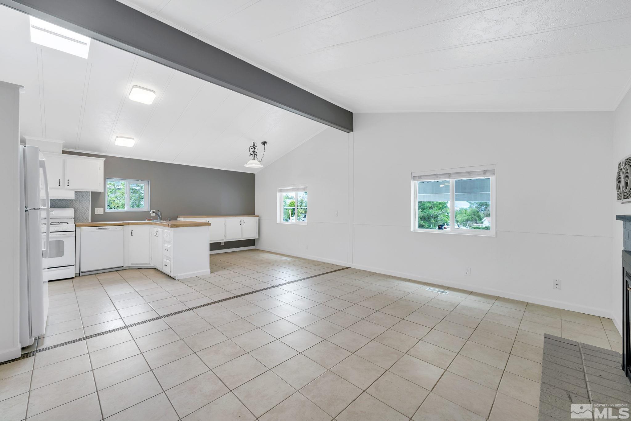 2177 Barberry Way Reno, NV 89512 - Photo 13 of 27 a view of a kitchen with white cabinets