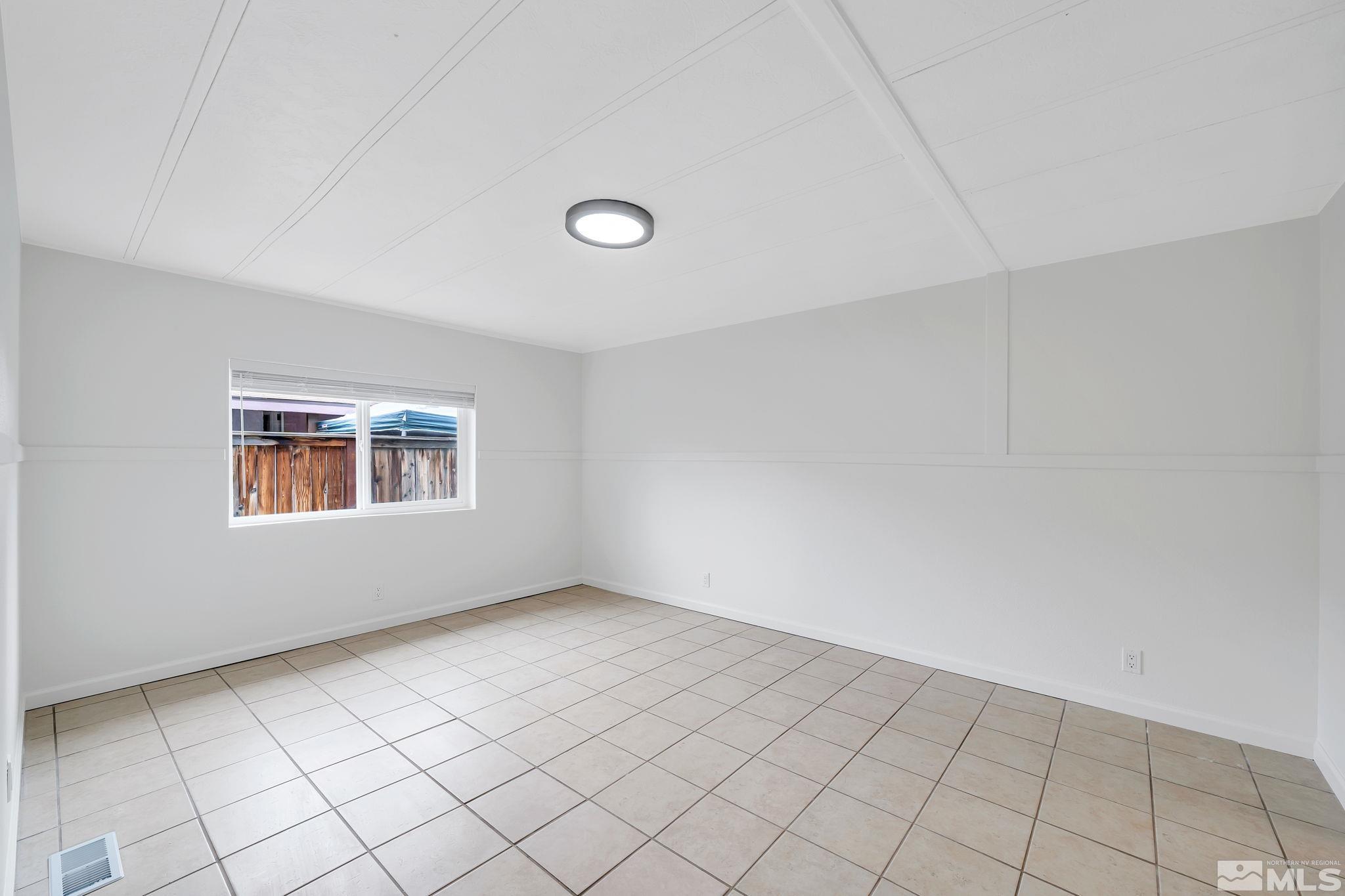 2177 Barberry Way Reno, NV 89512 - Photo 17 of 27 a view of an empty room with a window