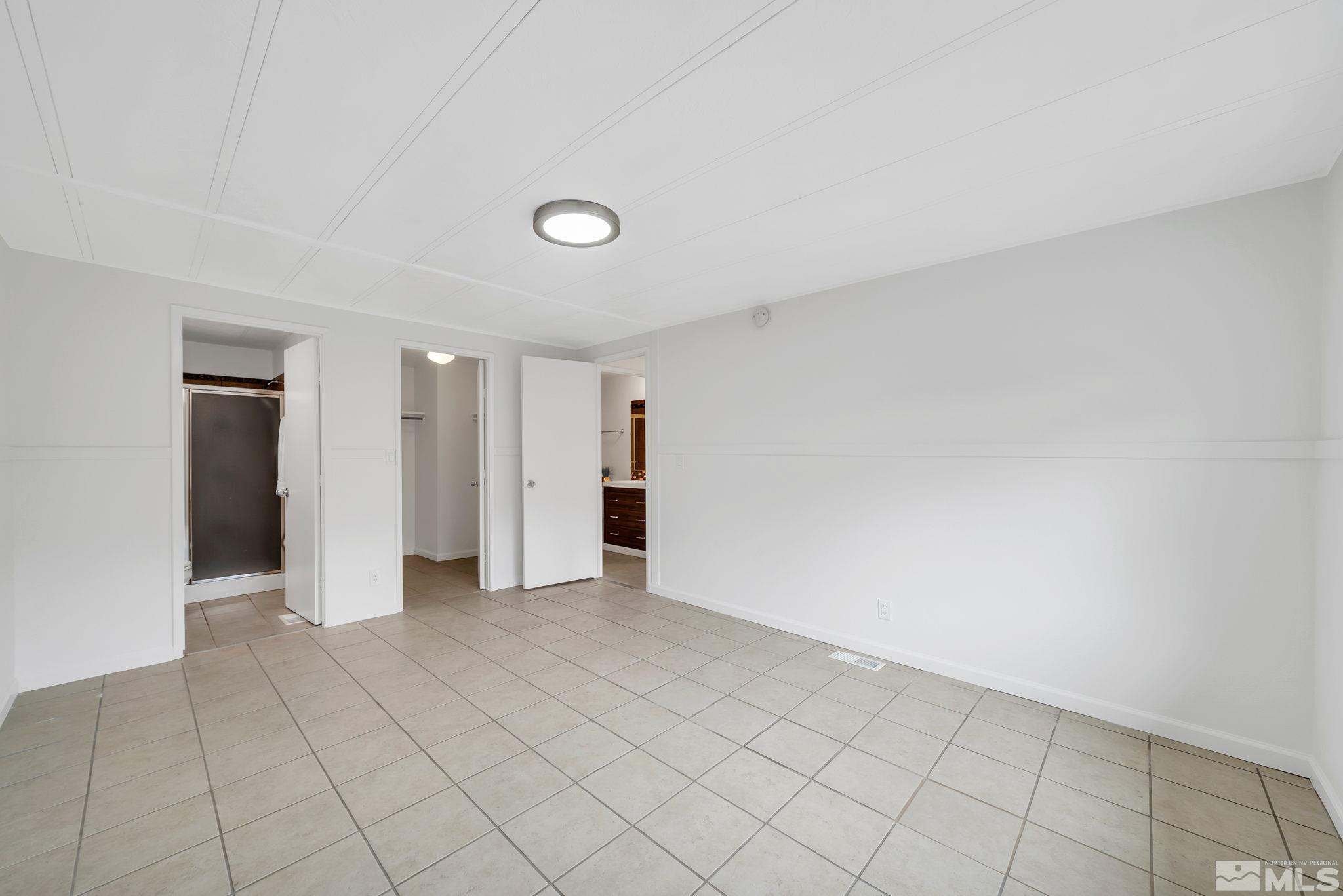 2177 Barberry Way Reno, NV 89512 - Photo 18 of 27 an empty room with a natural light