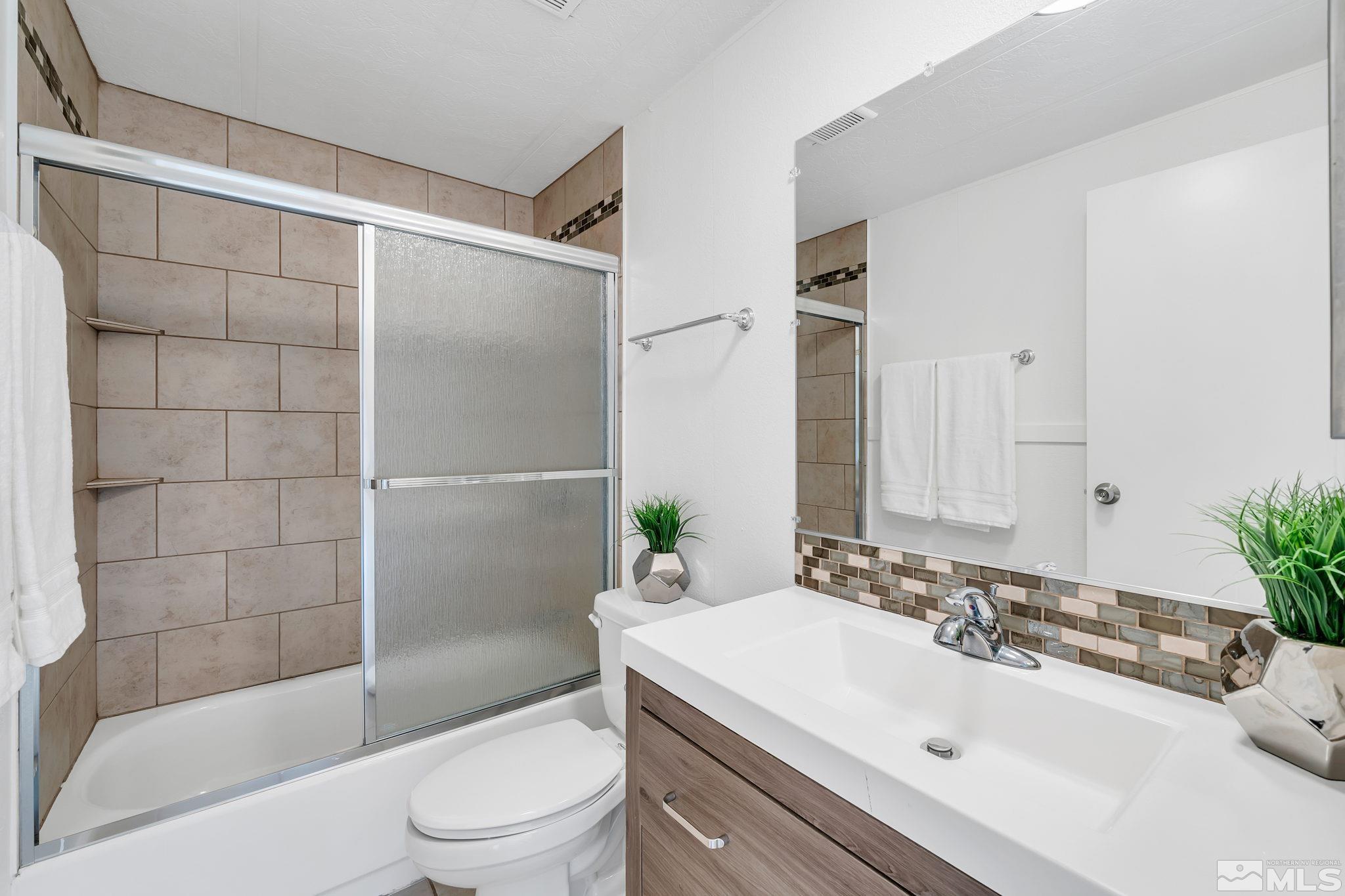 2177 Barberry Way Reno, NV 89512 - Photo 23 of 27 a bathroom with a sink toilet and shower