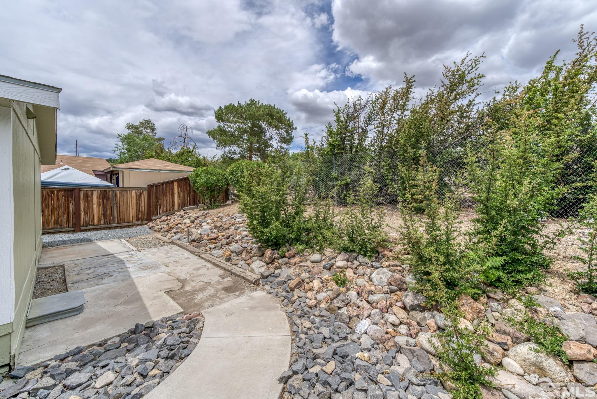 2177 Barberry Way Reno, NV 89512 - Photo 24 of 27 a view of a house with a yard
