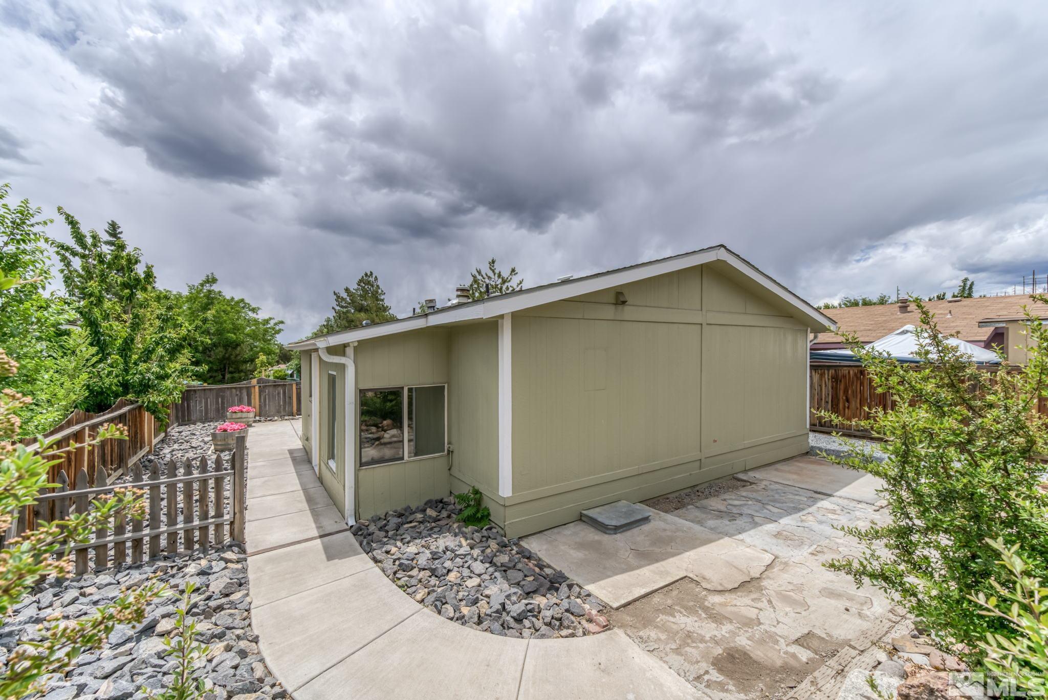 2177 Barberry Way Reno, NV 89512 - Photo 25 of 27 a view of a house with a yard