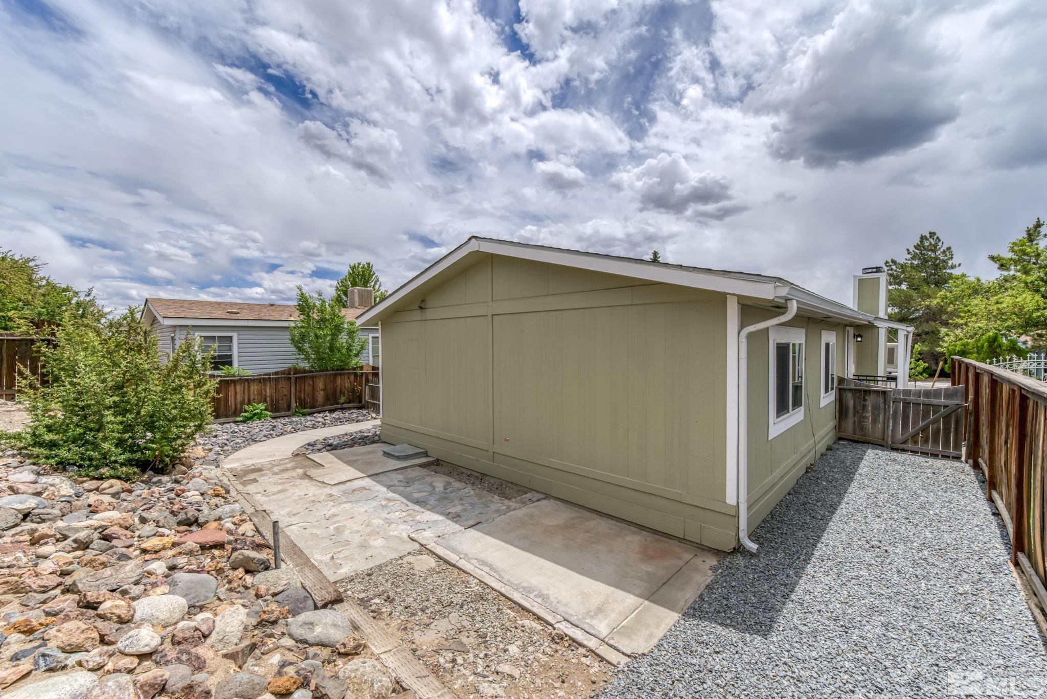 2177 Barberry Way Reno, NV 89512 - Photo 26 of 27 a backyard of a house with wooden fence