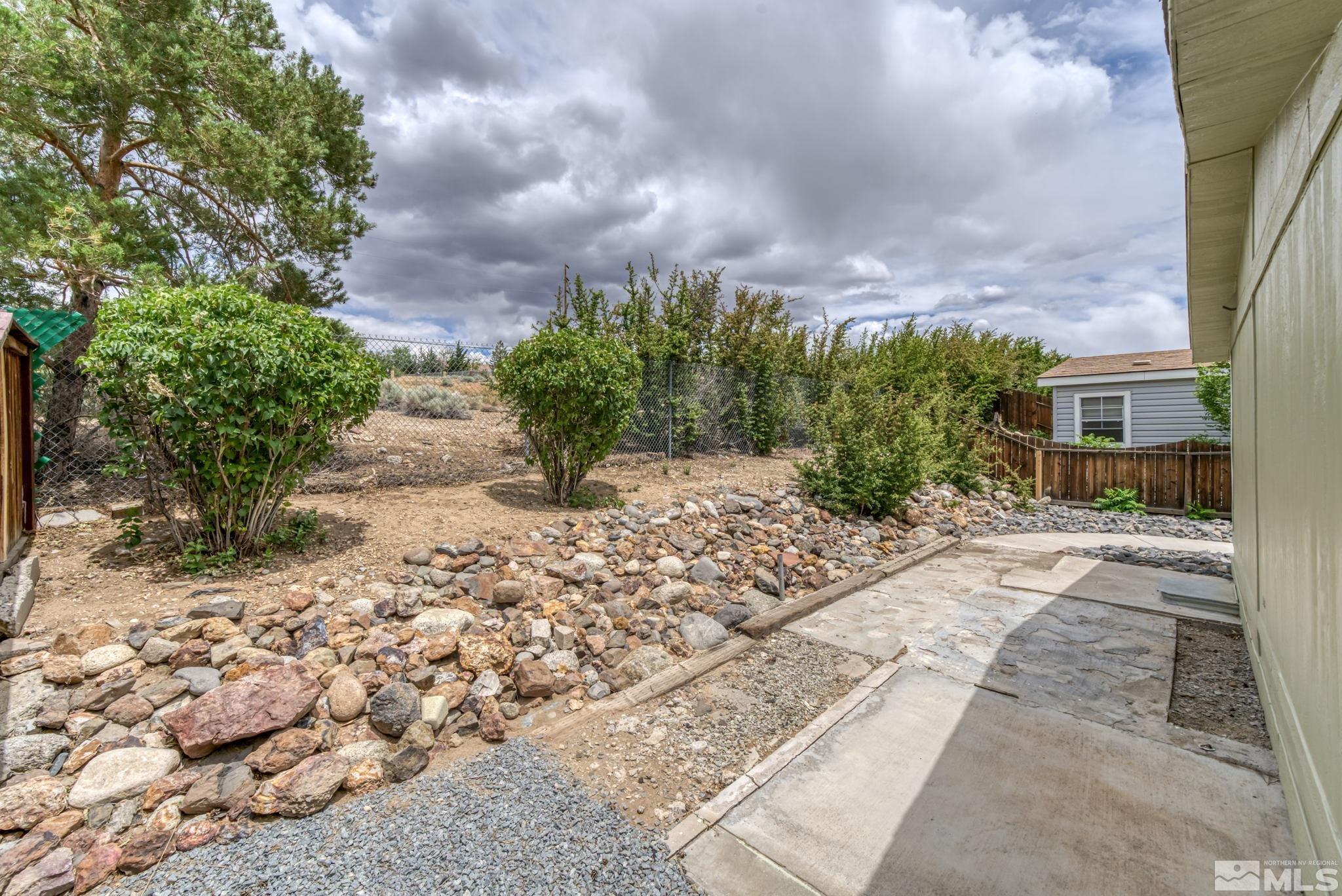 2177 Barberry Way Reno, NV 89512 - Photo 27 of 27 a view of a yard with plants and trees