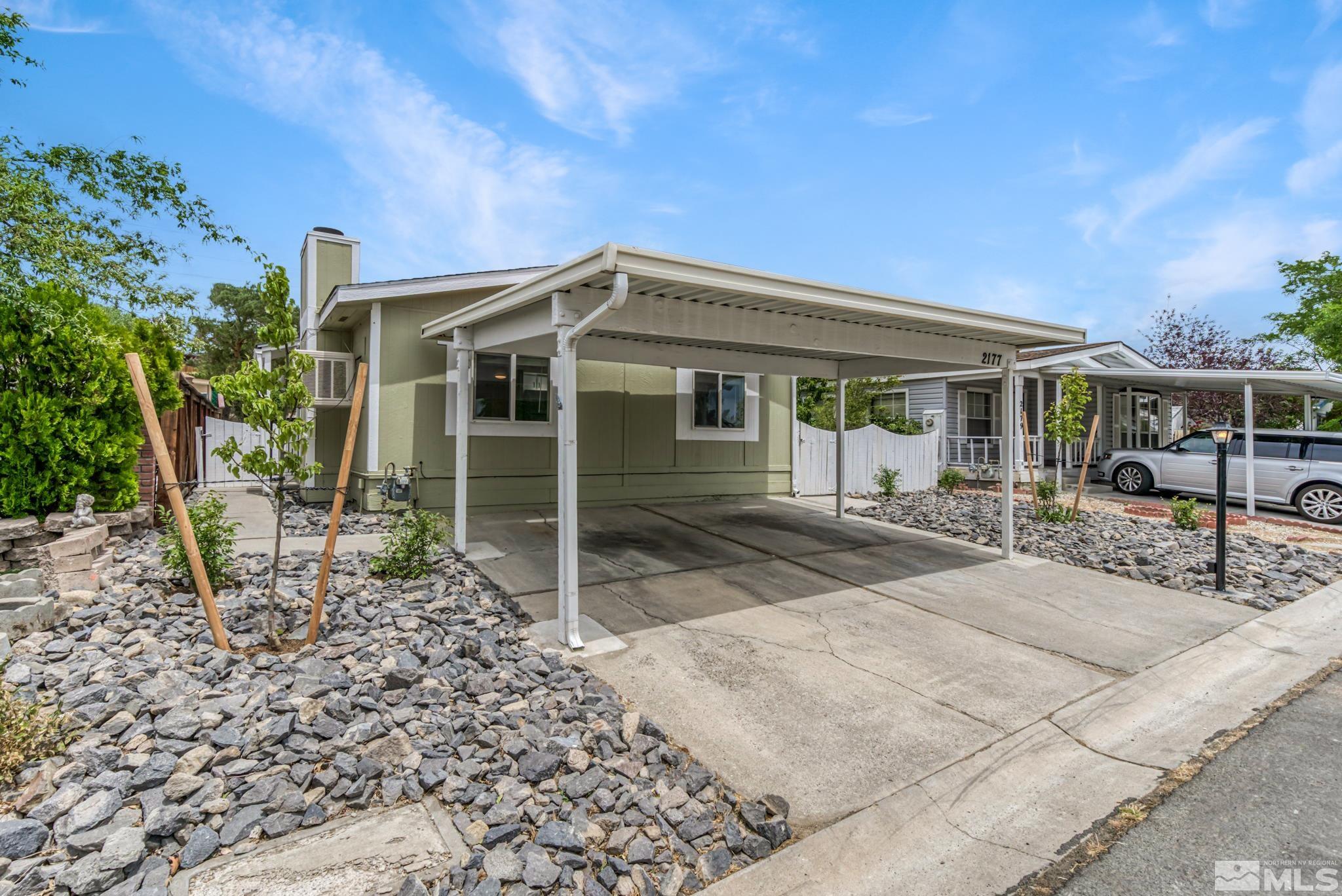 2177 Barberry Way Reno, NV 89512 - Photo 3 of 27 a front view of a house with garden