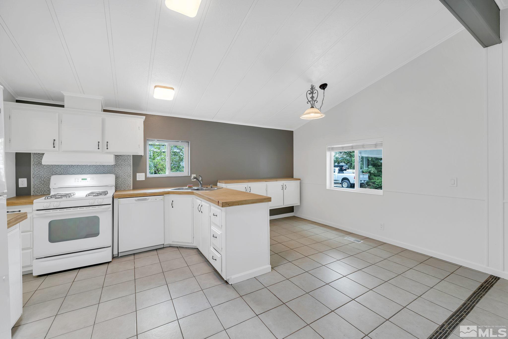 2177 Barberry Way Reno, NV 89512 - Photo 8 of 27 a kitchen with a cabinets and a stove