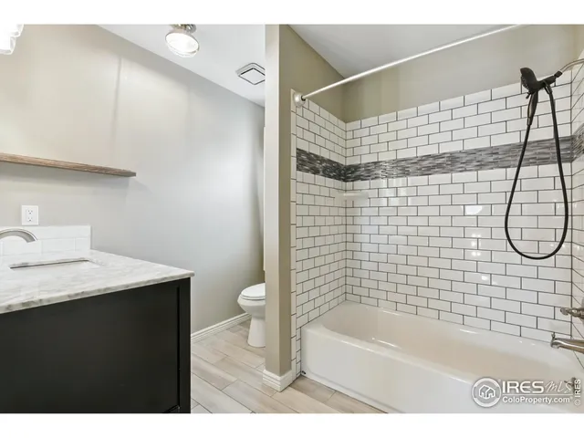 a bathroom with a sink vanity and a mirror