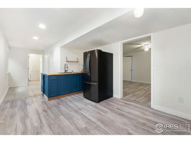 a kitchen with stainless steel appliances a refrigerator and a sink