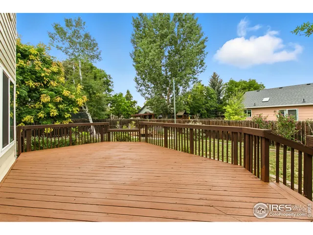 a view of road with large trees