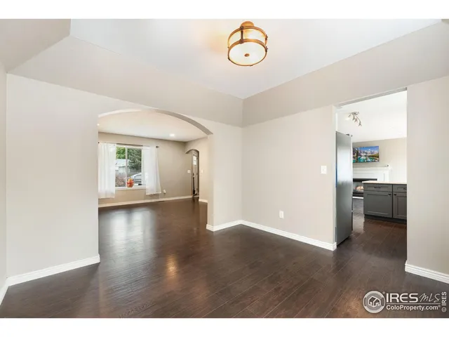 a kitchen with stainless steel appliances a refrigerator sink and cabinets