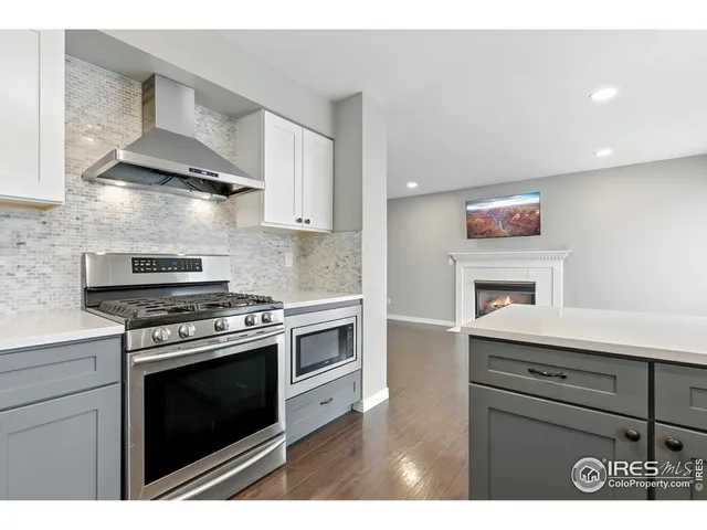 a view of kitchen with wooden floor