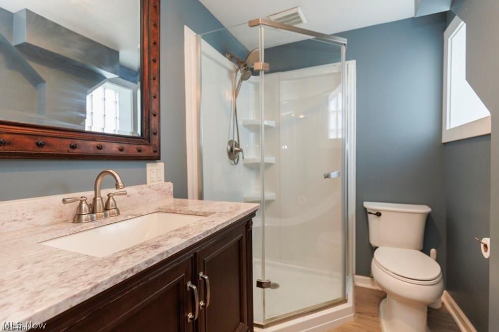 32618 Detroit Road Avon, OH 44011 - Photo 33 of 40 Vanity with a light-colored countertop, undermount sink, and brushed nickel faucet