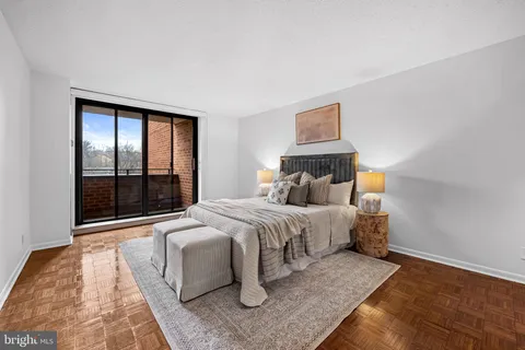 a bedroom with bed and window