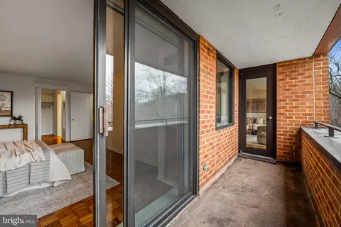 a view of a hallway with living room and furniture