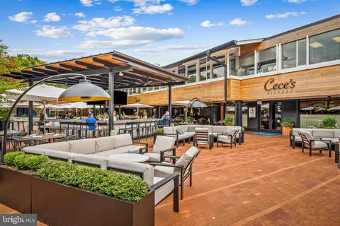 a outdoor space with lots of tables and chairs