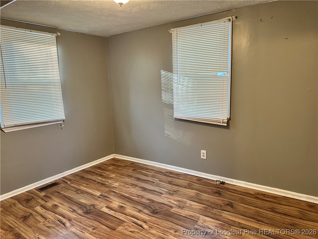 2986 Doc Brown Road Raeford, NC 28376 - Photo 4 of 14 a view of a room with wooden floor and a window