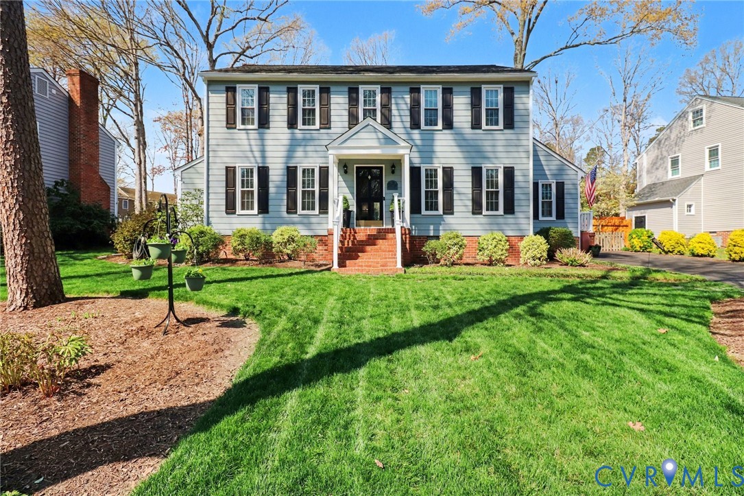 a house with garden in front of it