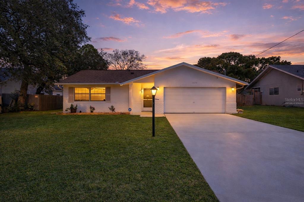 a view of a house with a big yard