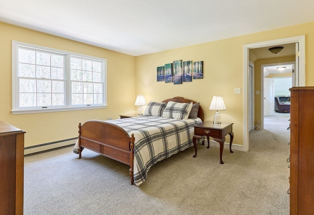 58 Buttercup Lane Hanover, MA 02339 - Photo 19 of 35 a bedroom with a bed chair and a window