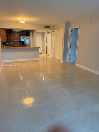 a view of a livingroom with a kitchen