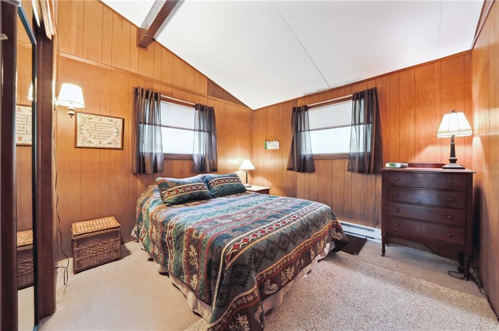 510 Forest Road Acme, PA 15610 - Photo 12 of 30 a bedroom with a bed and a dresser