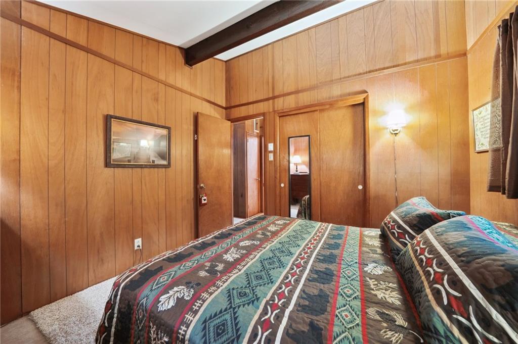 510 Forest Road Acme, PA 15610 - Photo 14 of 30 a bedroom with a bed and a painting on the wall