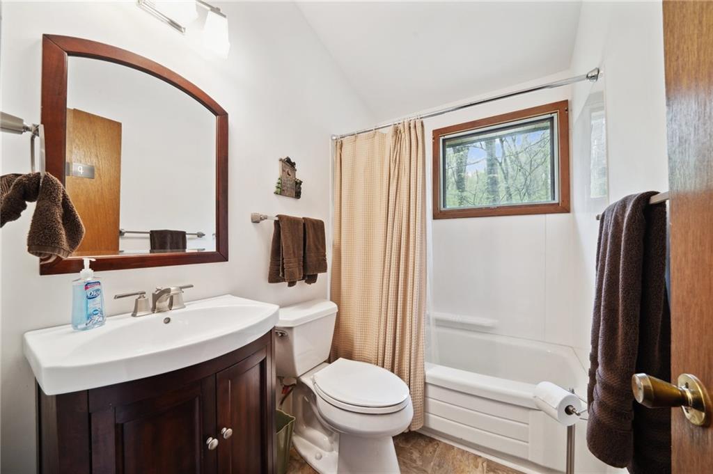 510 Forest Road Acme, PA 15610 - Photo 15 of 30 a bathroom with a sink toilet and shower