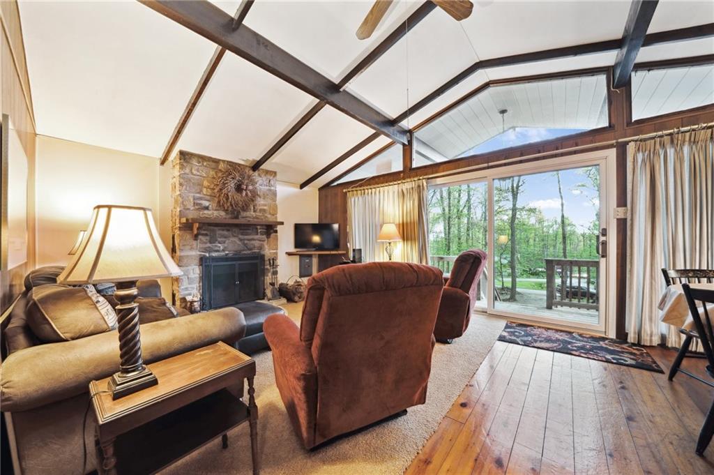 510 Forest Road Acme, PA 15610 - Photo 2 of 30 a living room with furniture and a floor to ceiling window