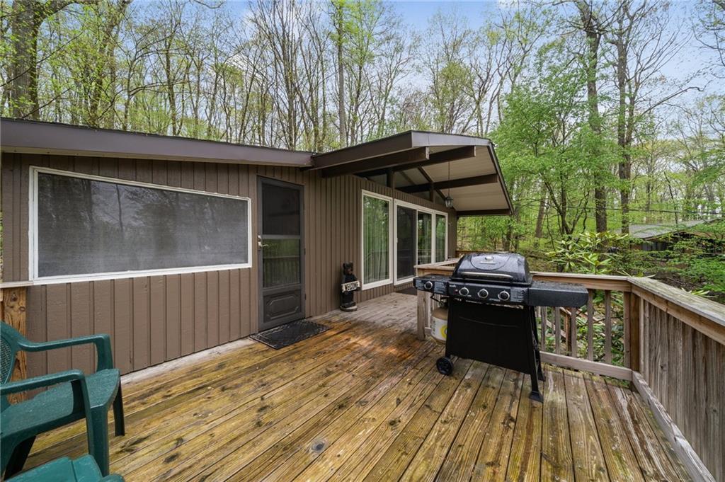 510 Forest Road Acme, PA 15610 - Photo 24 of 30 a view of backyard with barbeque grill and wooden fence